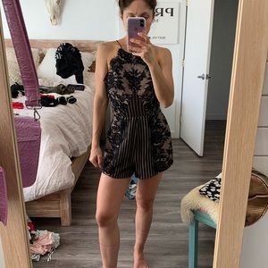 Black lace romper from REVOLVE